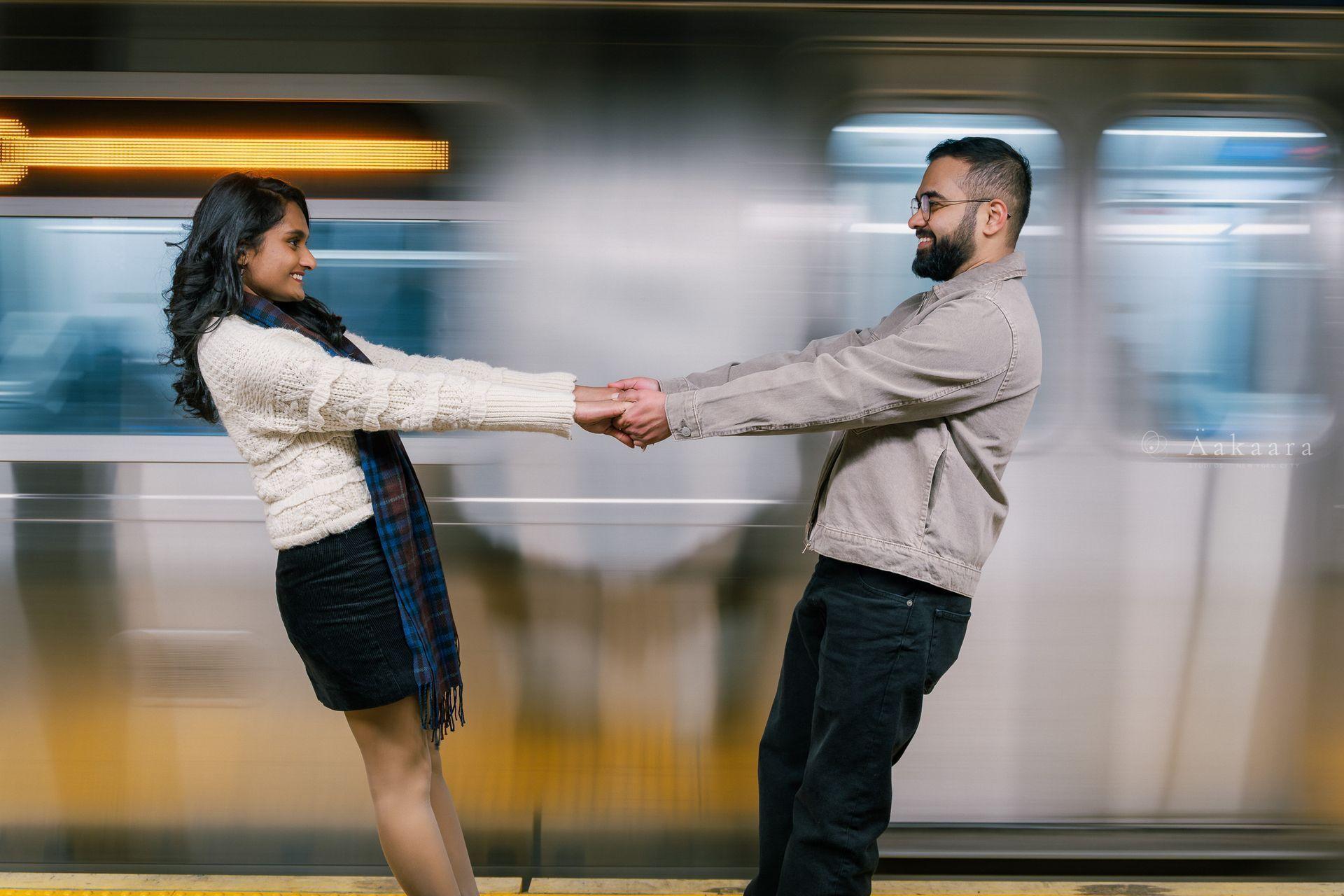 A couple walking on the iconic Brooklyn Bridge.